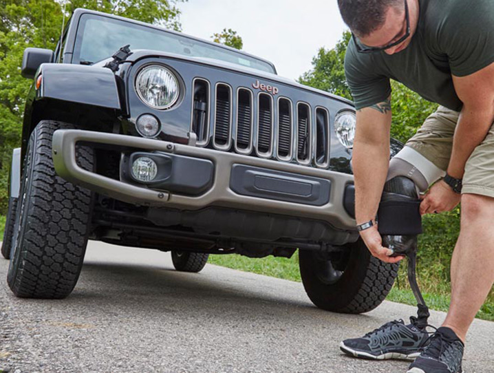Jeep Wrangler - Man in front of grille